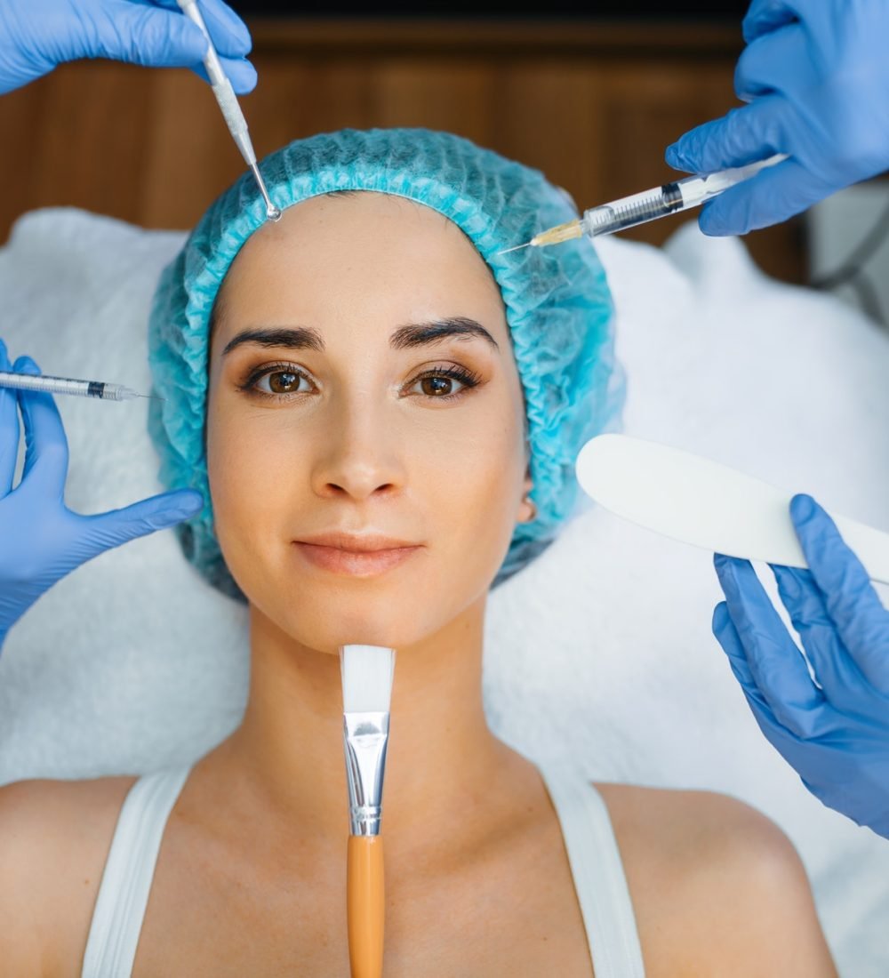 cosmetician-hands-with-working-tools-patient-face.jpg